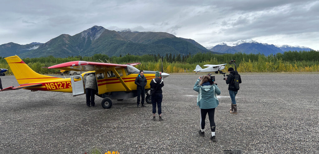 SuePerkinsPlane Our producer and cinematographer shooting an interview in the field