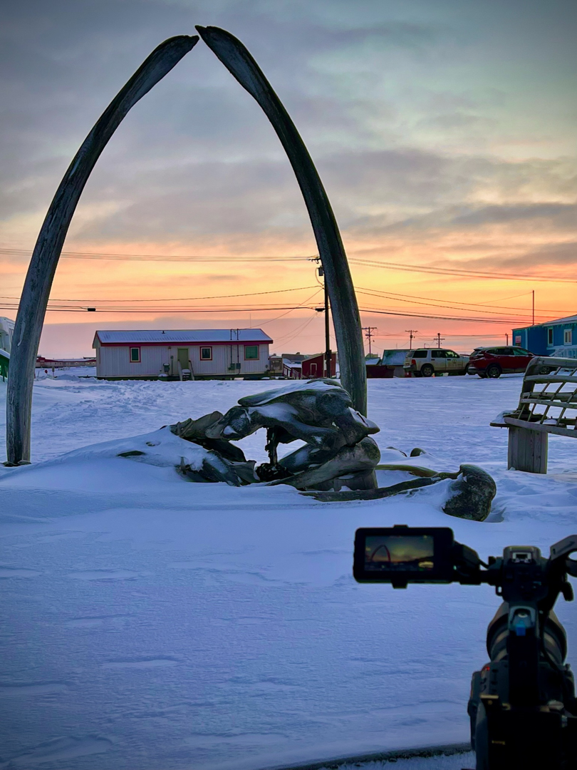Frostline-Studios_Filming-in-Barrow-Utqiagvik-Alaska Filming at sunset in Utqiagvik, Alaska at the whale bone arch.